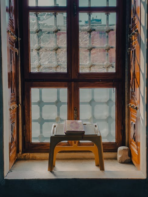 A beautifully displayed Quran on a stand near a mosque window in İstanbul, Turkey.